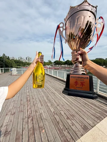 The third-place trophy held beside the water after the SUP Polo tournament.